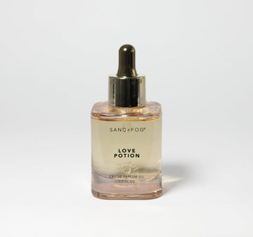 Sand + Fog Love Potion bottle close-up, highlighting premium glass and dropper for precise use