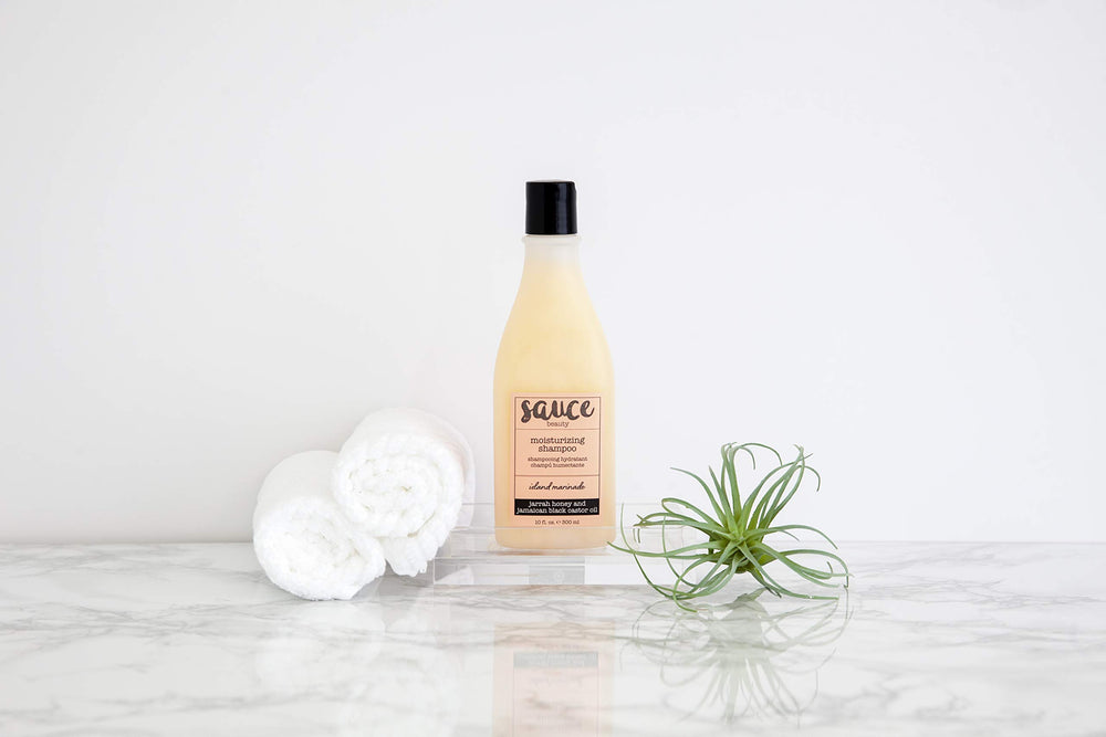 SAUCE BEAUTY Island Marinade Shampoo on hair demonstrates frizz control and shine.