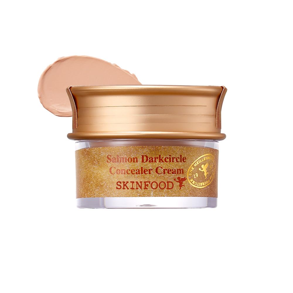 SKINFOOD 1957 corrector de ojeras con extracto de salmón, empaque compacto para retoques diarios.