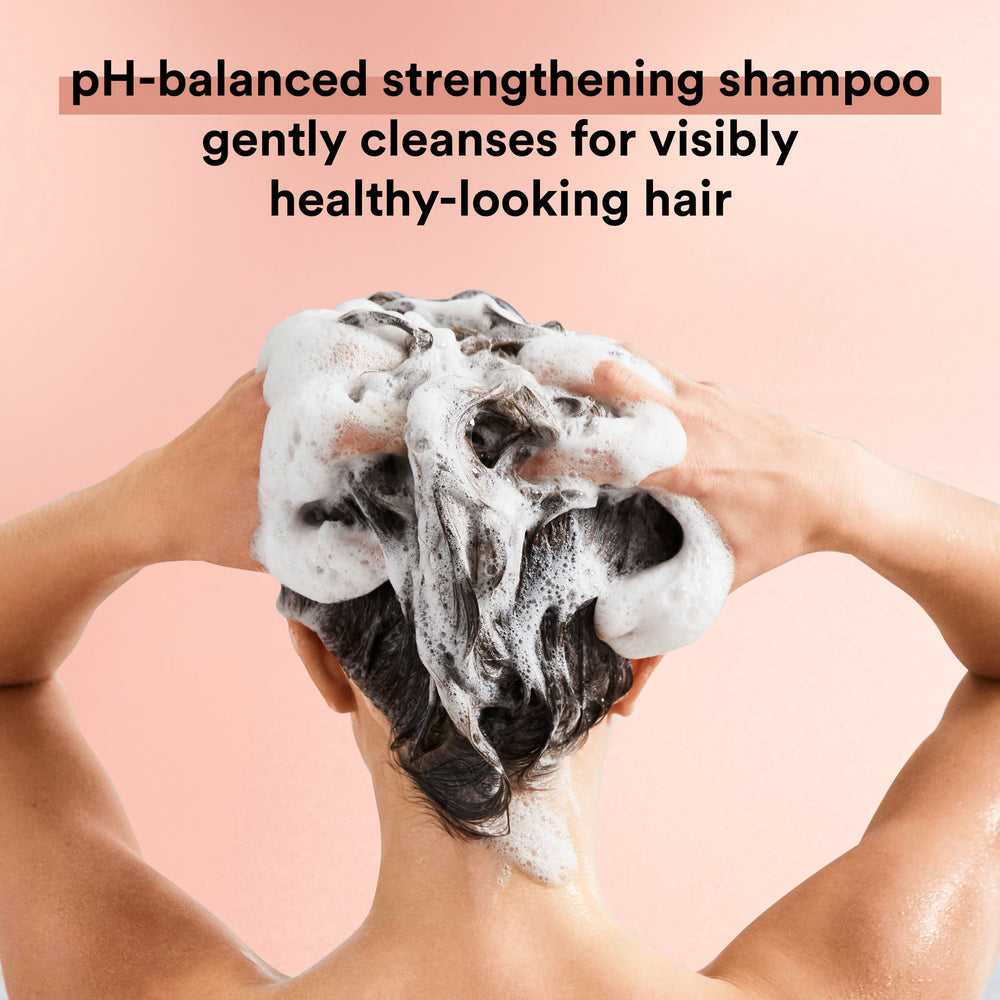 Suave Keratin Infusion shampoo lather close-up shows cleansing and moisture.
