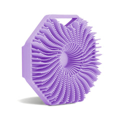 Sud Scrub, cepillo de silicona antimicrobiana morado, exfolia suavemente y cuida la piel.