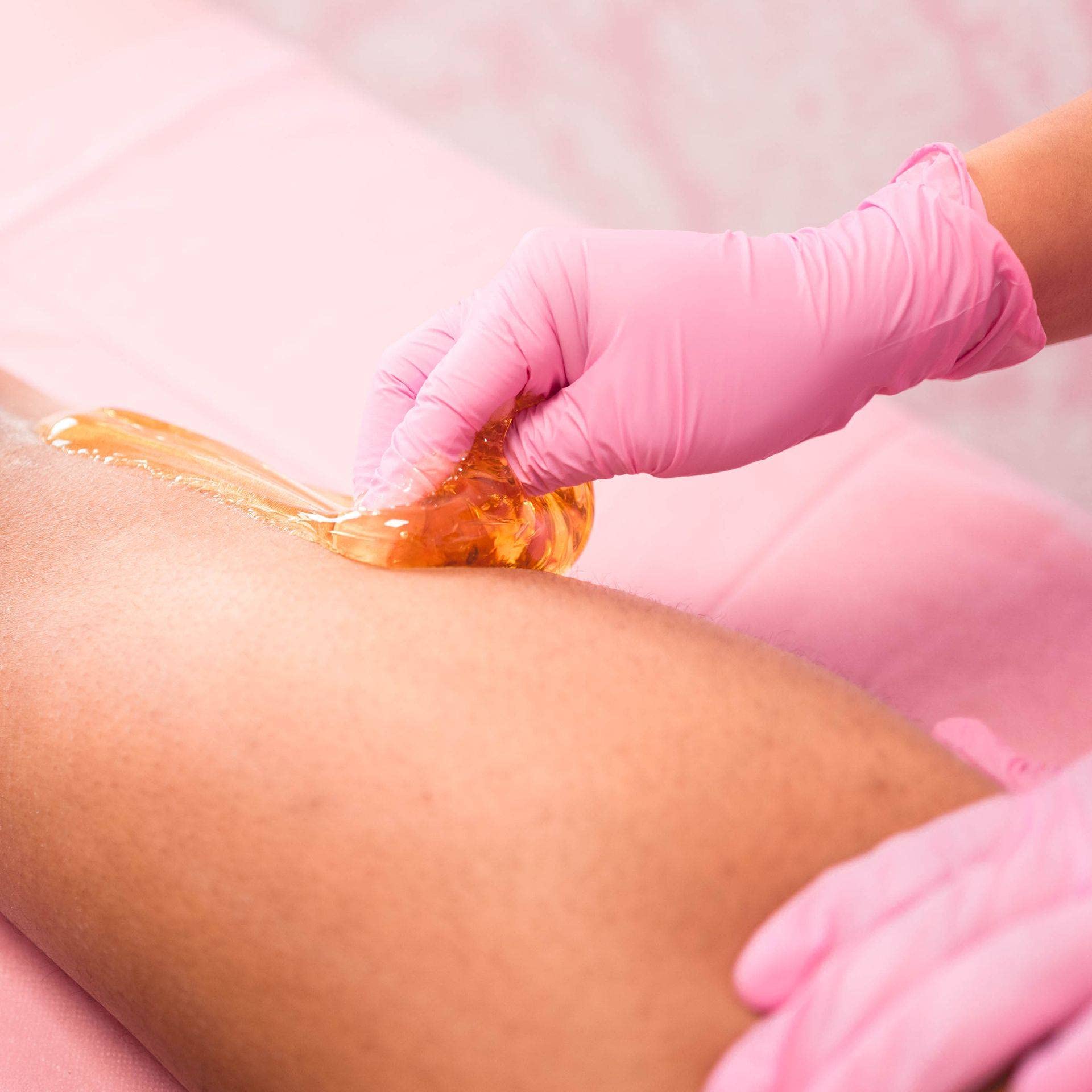 Sugaring NYC paste applied to underarms for quick, gentle hair removal