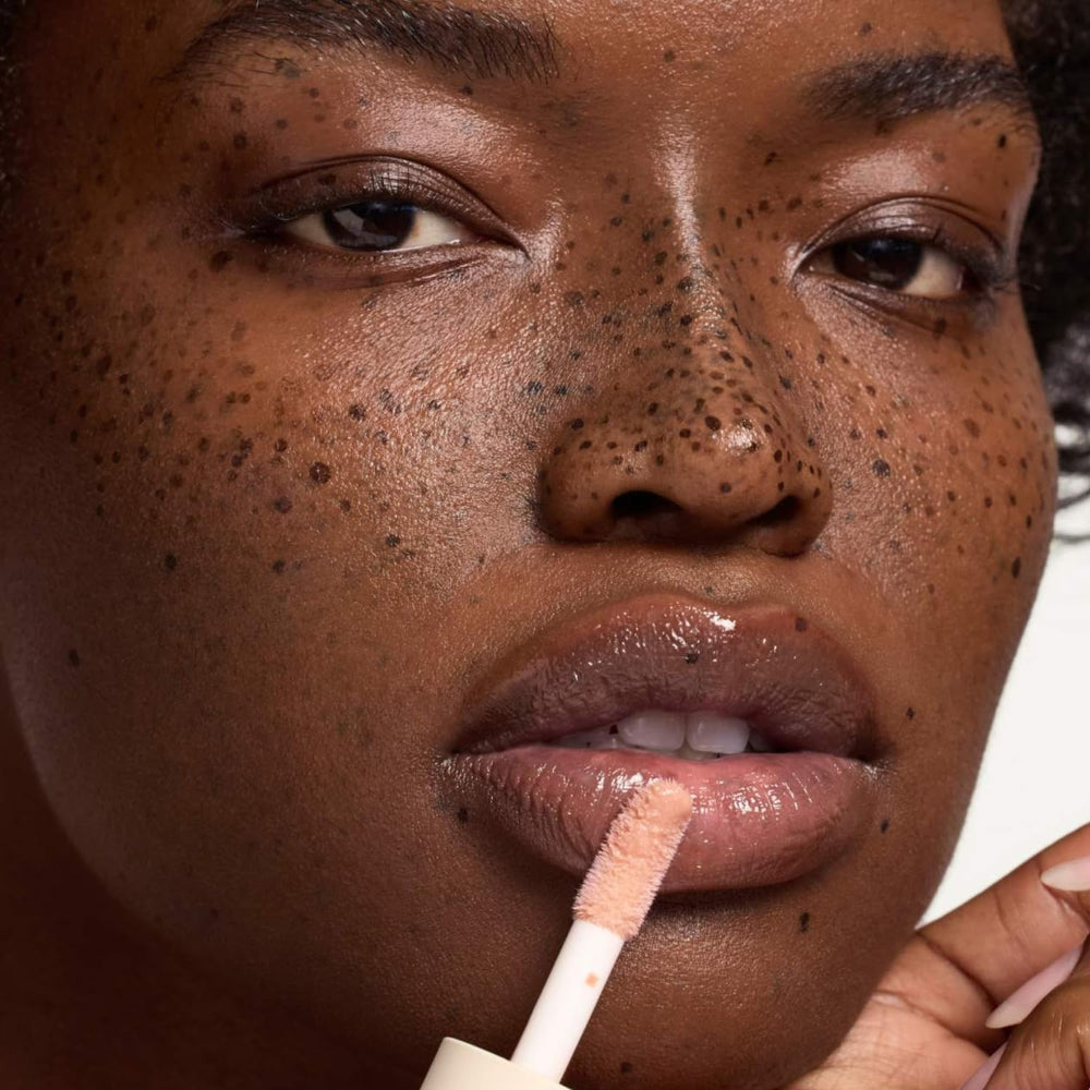 Bare Sand tinted look on lips with Dream Lip Oil for subtle color