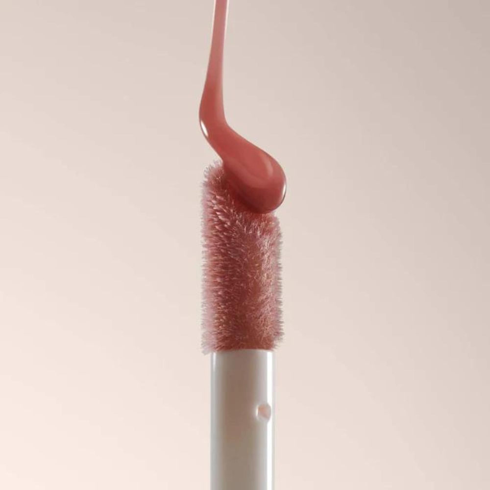 Summer Fridays Dream Lip Oil layered over lipstick for dimension
