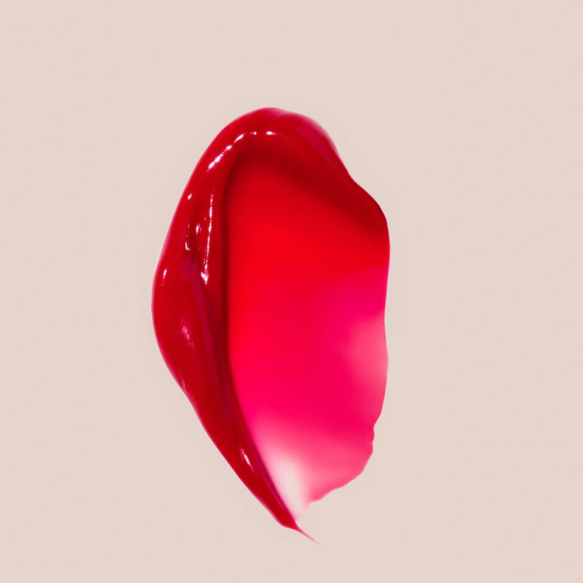 Summer Fridays Cherry lip butter applied to lips offering instant moisture and subtle shine.