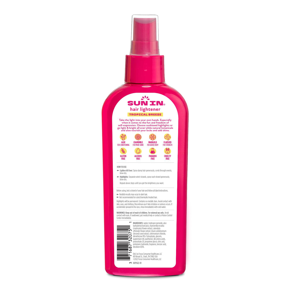 Sun-In mist application demonstrates quick, even coverage on damp hair.
