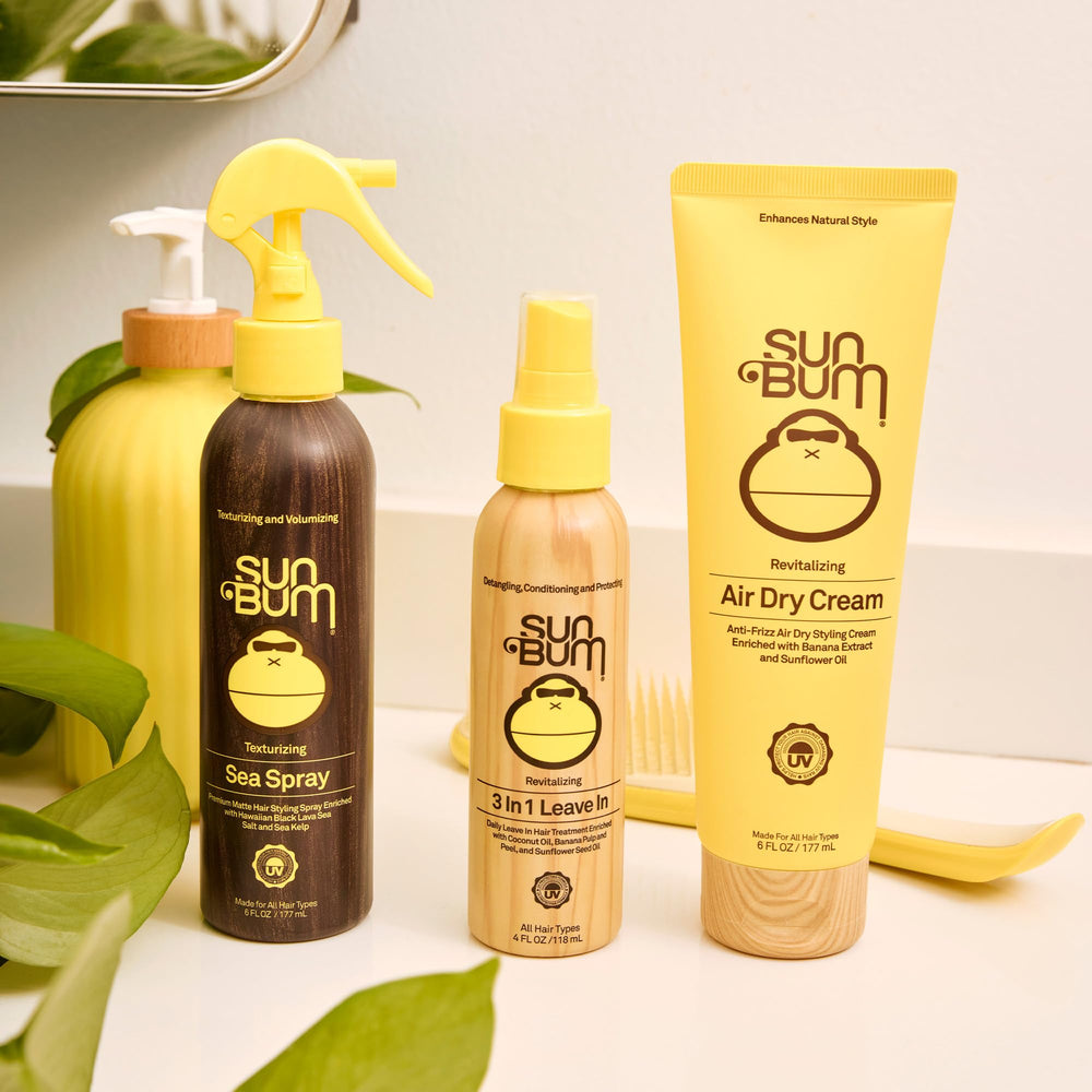Sun Bum Revitalizing Air Dry Cream on a beachy vanity, great for all hair types.