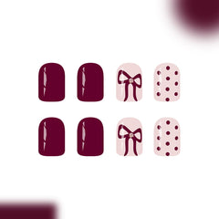 SYPAFG uñas burgundy con lazo y puntos, diseño clásico para cualquier ocasión.