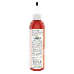 Aplicación de African Healing Oyl en cabello para suavidad y brillo.