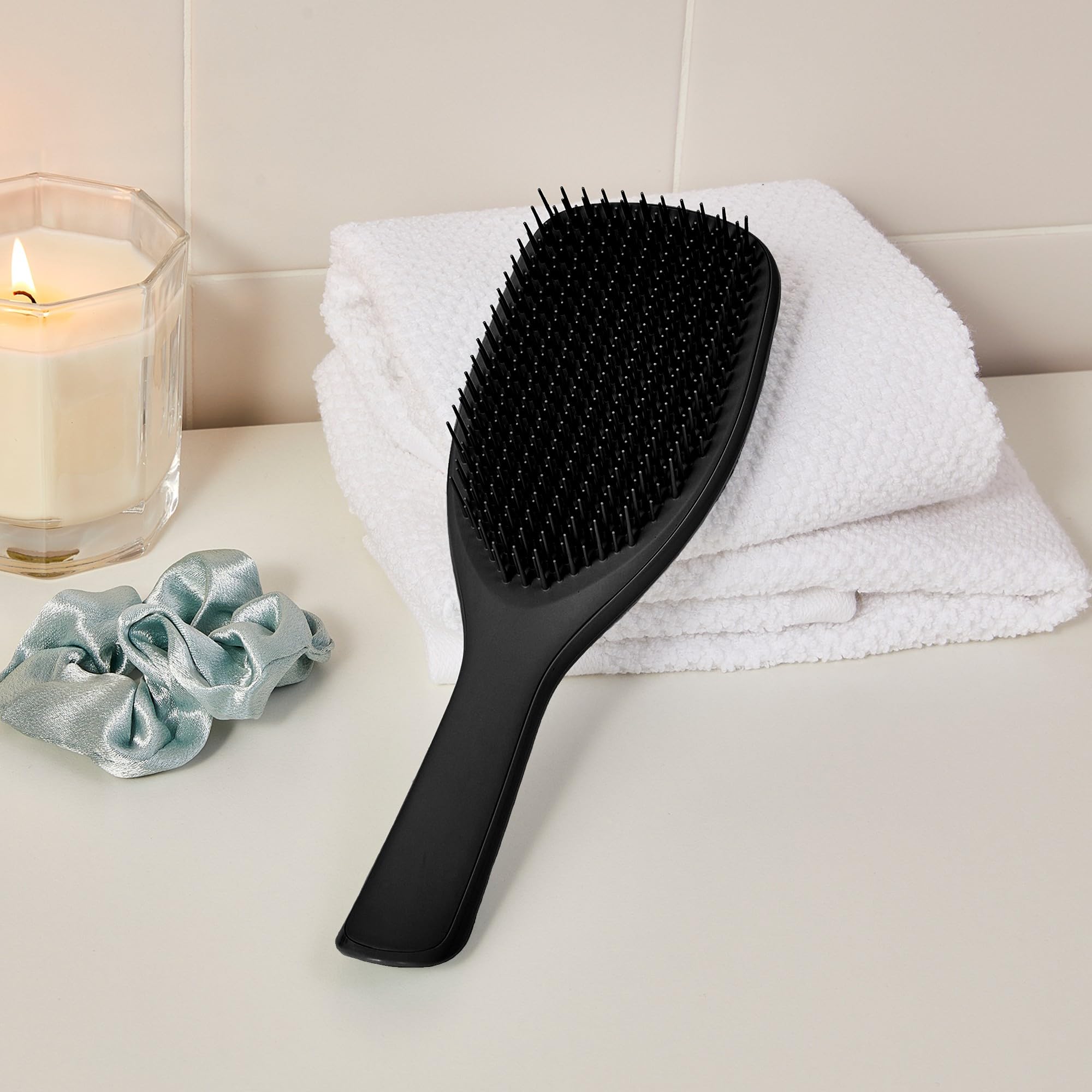 Tangle Teezer distribuye productos uniformemente en la ducha.