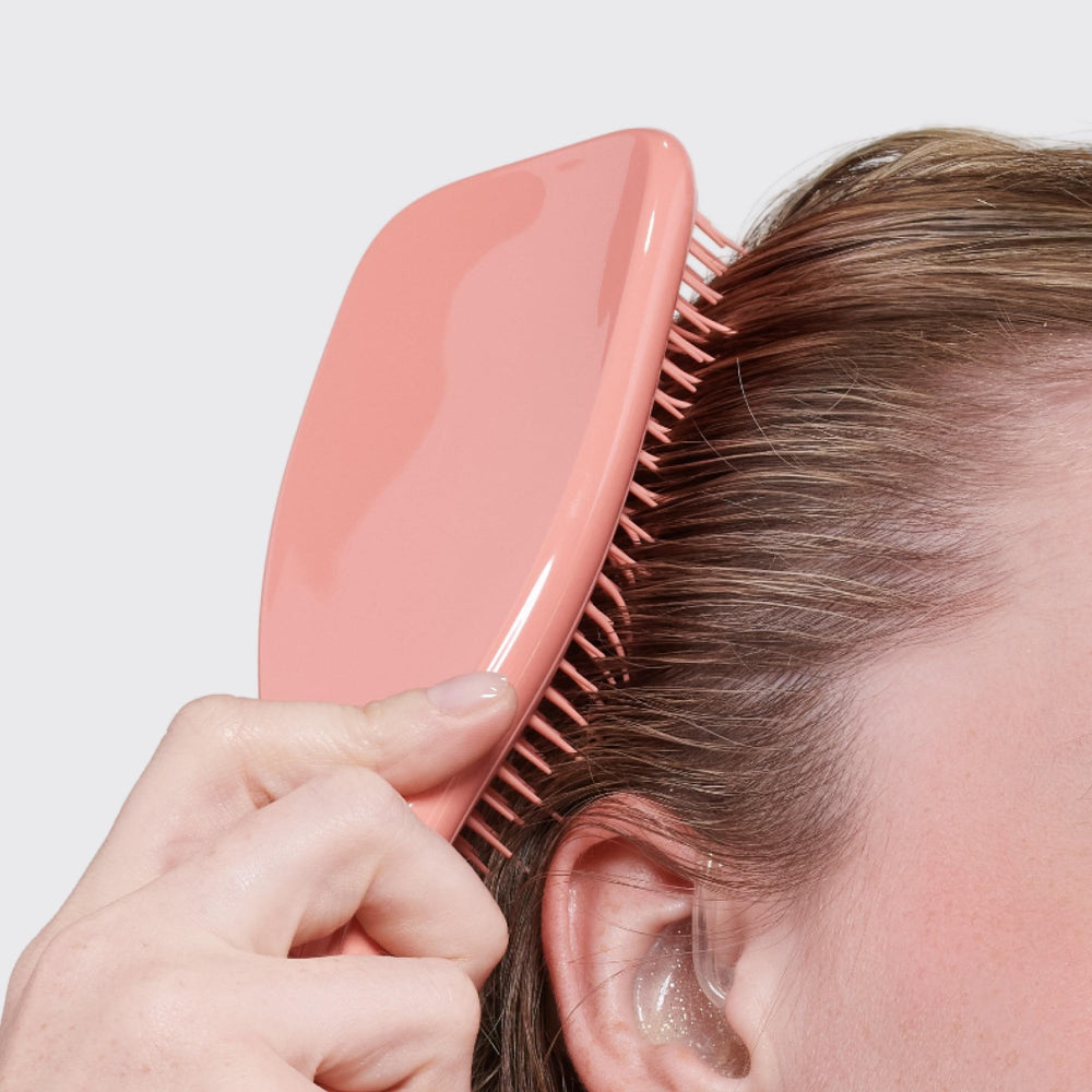 Cepillo Tangle Teezer cabello sedoso tras peinado diario.