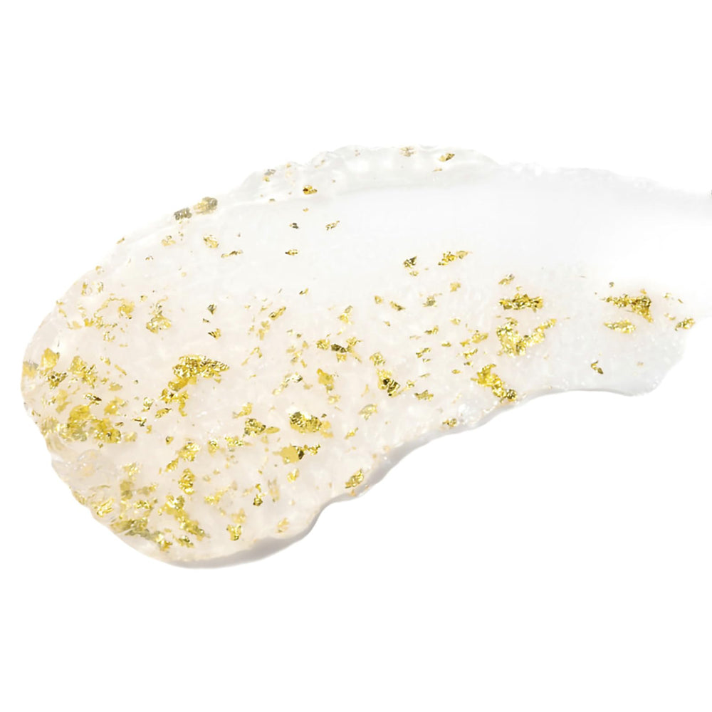 Tatcha Camellia Gold Spun Lip Balm – flocons d'or 23 carats apportant une brillance subtile.