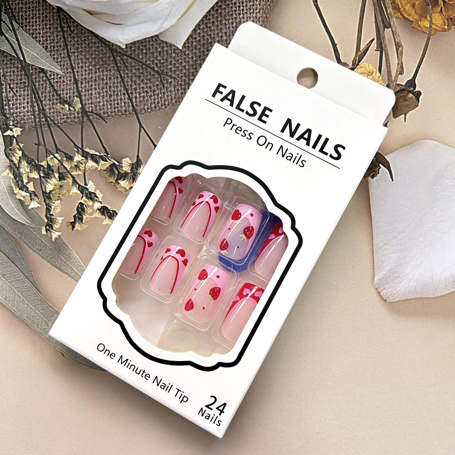 Kit incluido de uñas postizas de fresa para manicura en casa.