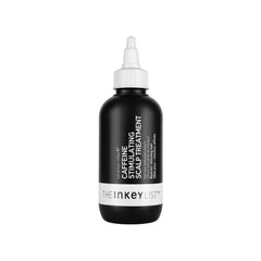 The INKEY List caffeine scalp treatment bottle for stimulating the scalp.