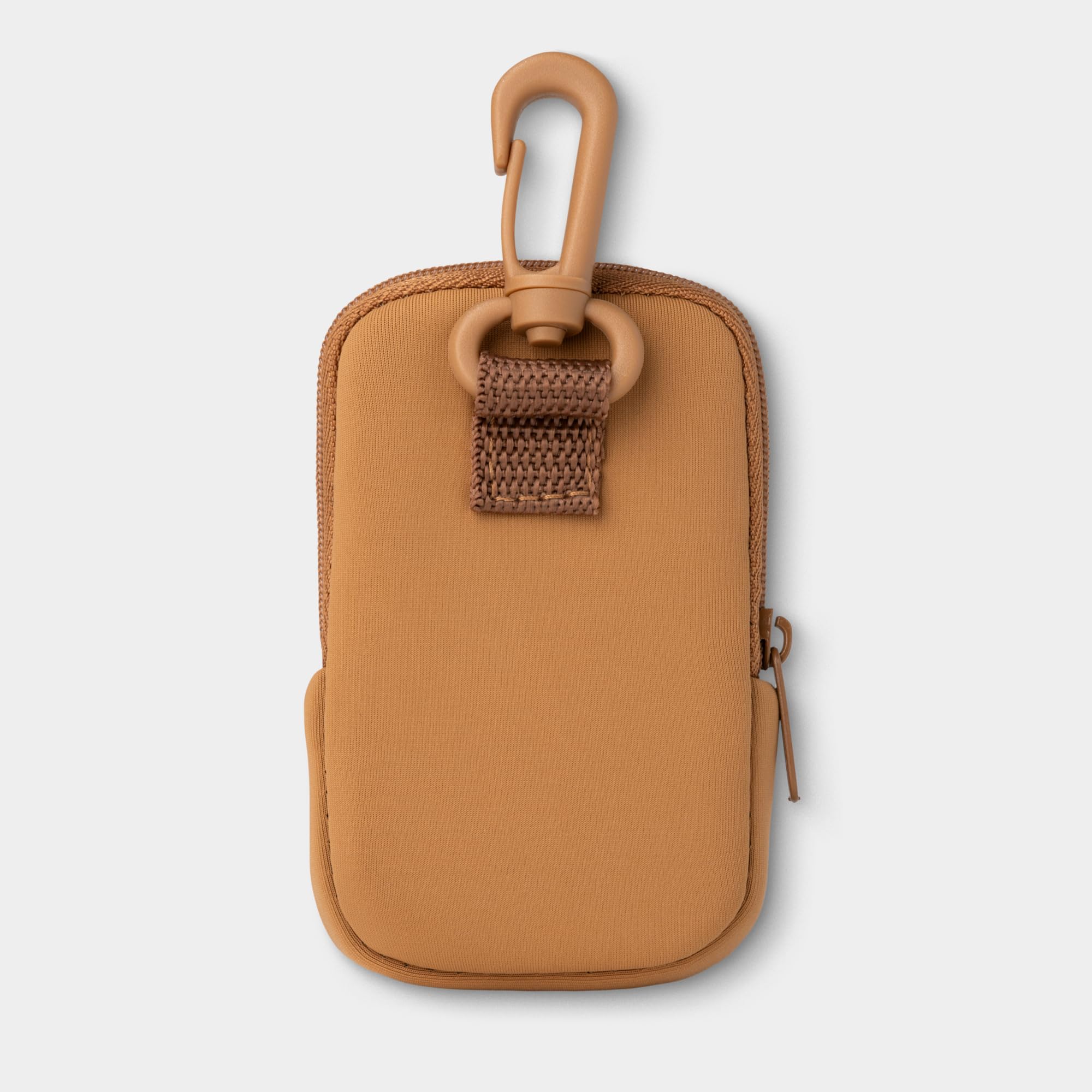 Touchland Touchette, diseño compacto en caramelo, caben esenciales a mano.