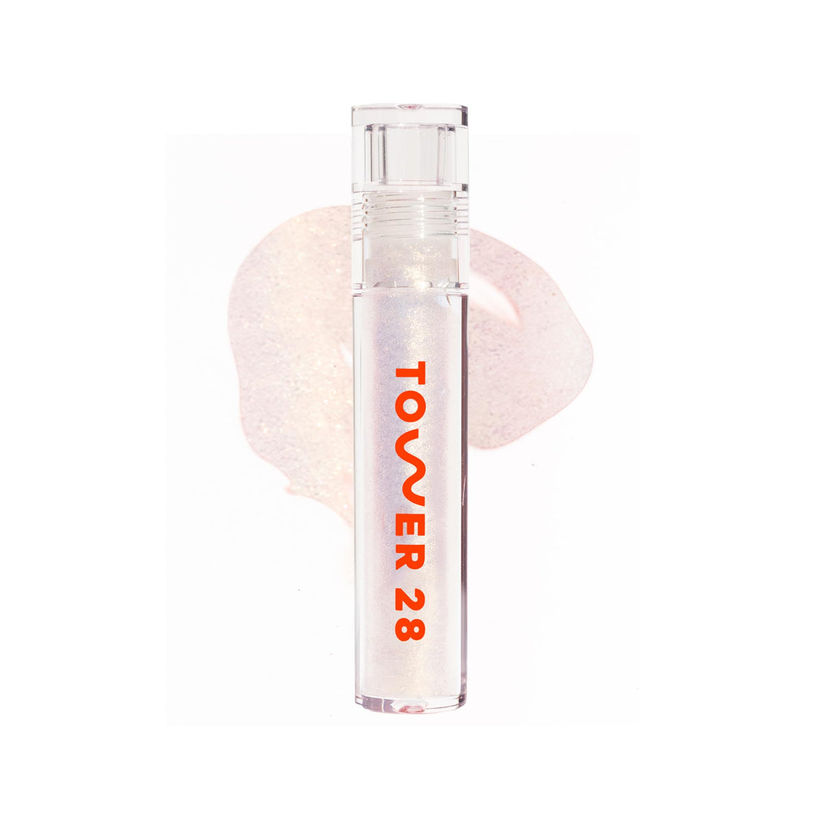 Tower 28 ShineOn Lip Jelly aplicación suave con brillo dorado sutil.
