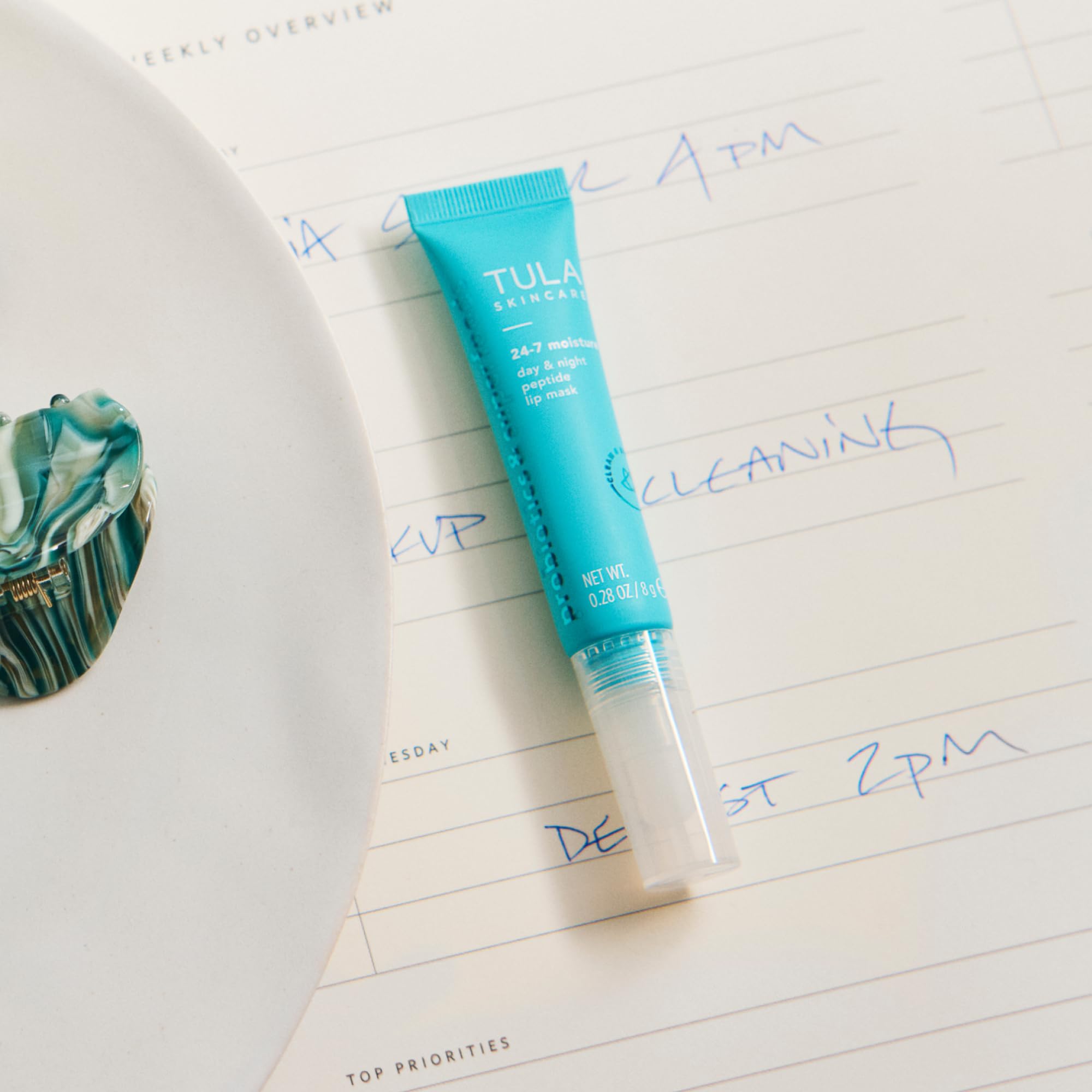 TULA lip mask packaging closeup shows clean, simple design