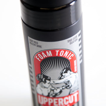 Protección de calor con quinoa y vitamina B5 en Tonico-Espuma de Uppercut Deluxe.