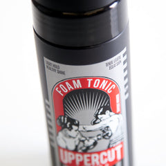 Protección de calor con quinoa y vitamina B5 en Tonico-Espuma de Uppercut Deluxe.