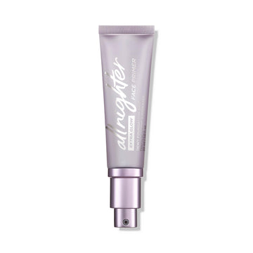 URBAN DECAY All Nighter Extra Glow Primer, botella translúcida, acabado luminoso y ligero para piel hidratada.