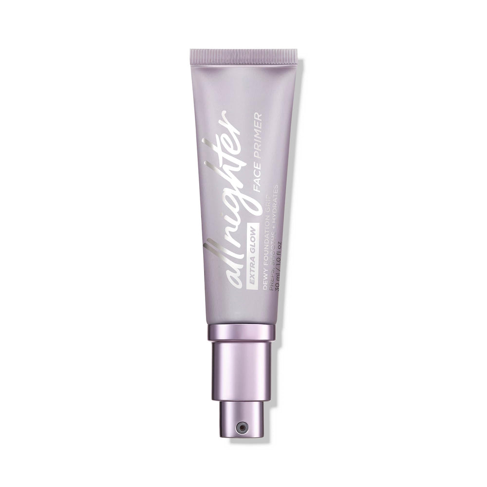 URBAN DECAY All Nighter Extra Glow Primer, botella translúcida, acabado luminoso y ligero para piel hidratada.