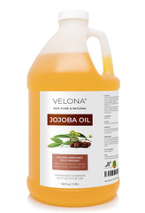 Velona Aceite de Jojoba: botella derramando para hidratar piel y cabello.