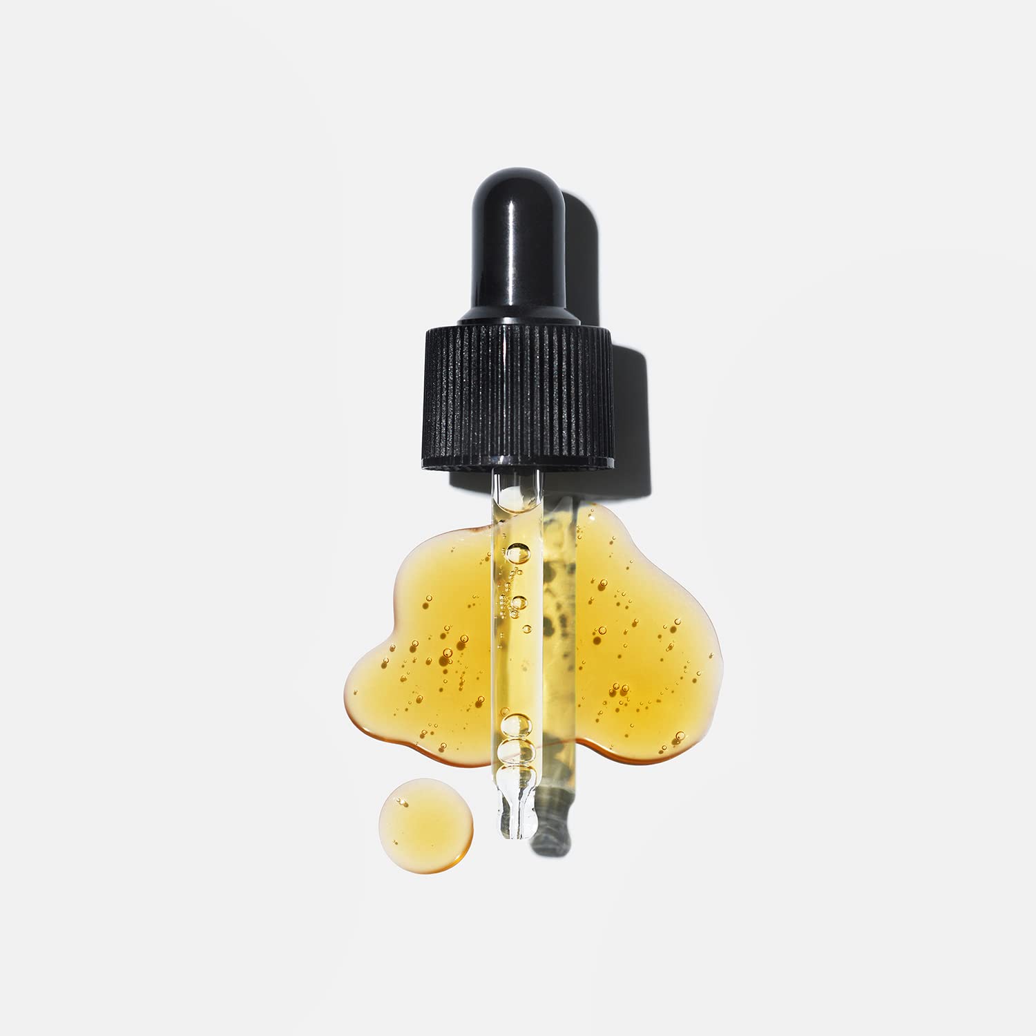 Versed Stroke of Brilliance serum swatch on skin showing glow