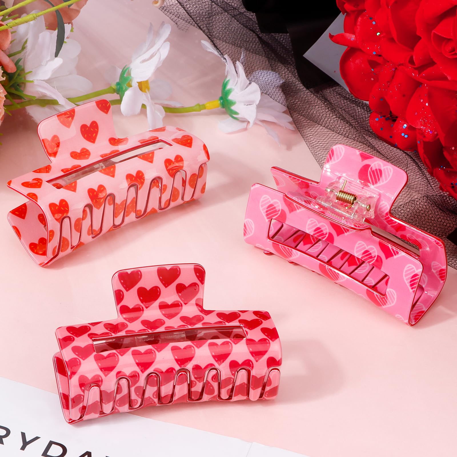 Detalle de diseño de corazón rosa en las pinzas Vovii, fácil de usar.