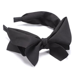 WantGor detalle textura tejido negro, aspecto elegante para cualquier peinado.