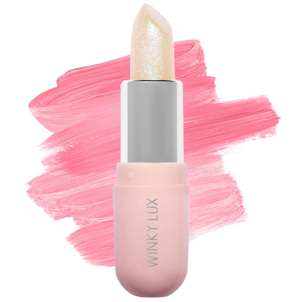 Bálsamo Unicorn Glimmer de Winky Lux, detalle de envase, hidratación suave para labios.