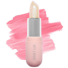 Bálsamo Unicorn Glimmer de Winky Lux, detalle de envase, hidratación suave para labios.