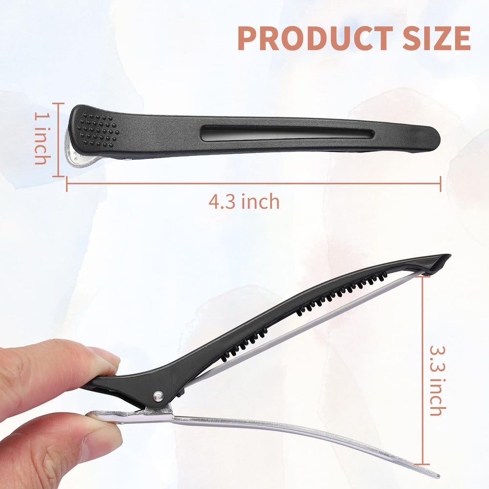 Pinzas XTIIEED negras con banda de silicona, ideal para seccionar el cabello sin tirones.