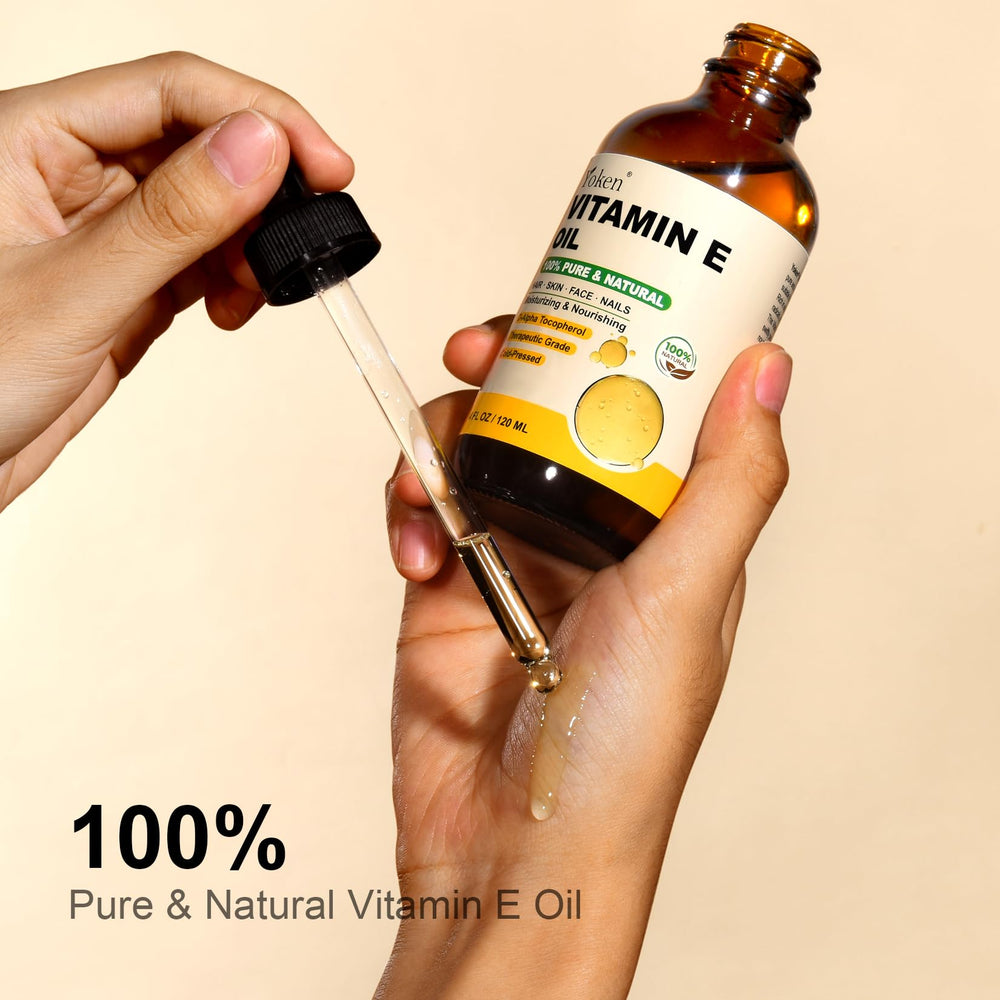 Yoken aceite vitamina E de color dorado con textura suave para masajes.
