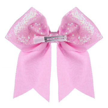 Estilo diario con lazo Zolyco rosa y brillo.