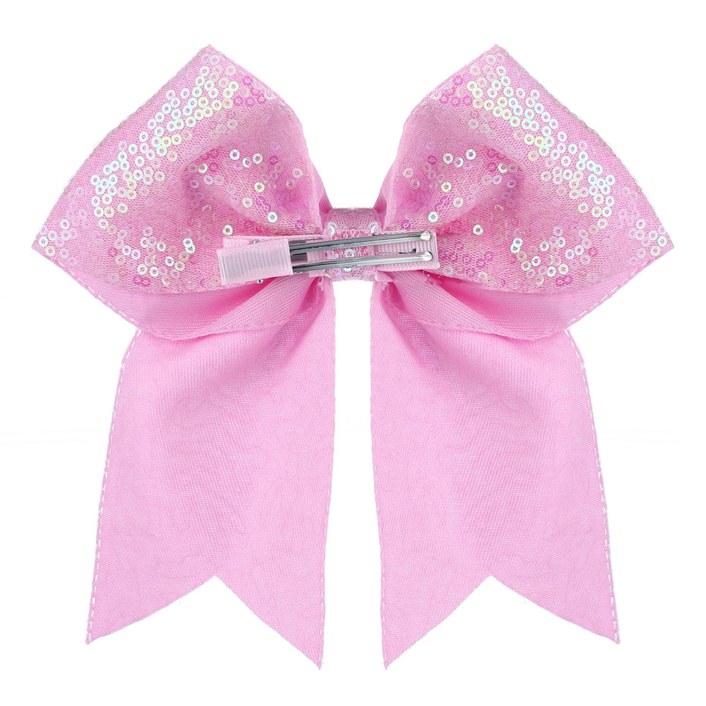 Estilo diario con lazo Zolyco rosa y brillo.